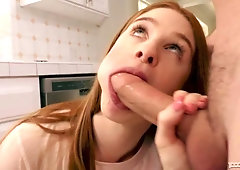 Beautiful redhead teen Scarlett Snow knows how to suck a fat dong
