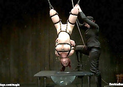 Bound redhead slave dunked in water