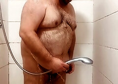 Hot guy enjoys steamy shower session