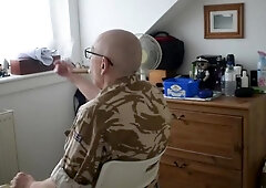 A headshave and a cigar for Captain S.