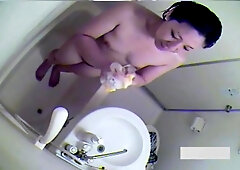 Sexy Asian brunette taking a long, hot bath caught on bath