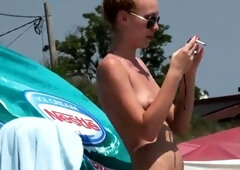 Blonde babe Kagney Karter plays with her big boobs