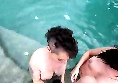 two slutty brunettes give their lifeguard a blowjob and cum swap