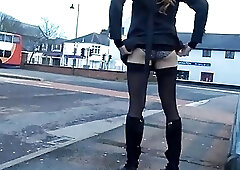 Tranny daring public bus station