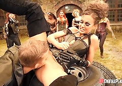 Fully-clothed dude fucks a naked babe's three holes outdoors