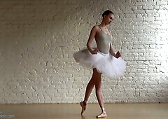 European ballerina dances nude in a private studio showcasing flexibility and muscle control
