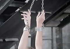 Luna shackled in an abandoned warehouse