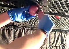 Milking table handjob with rubber gloves.