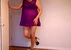 Blonde in nude pantyhose, black high heels and no knickers