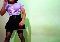 In miniskirt nylons and heels T-Girl, tranny.