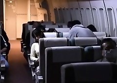 Busty Japanese wife satisfies her desire for cock on a plane