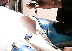 Girl in latex costume plays with bitch