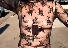 See through top on busy beach street tits on display