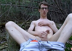 Geeky twink Sacha West jacking his cock outdoors