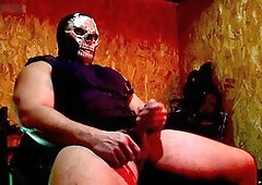 Buff guy in uniform giving himself a handjob with his massive cock