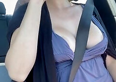 Italian milf Artemisia Love shows off her huge natural tits while driving around