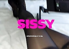 CROSSDRESSER IN NYLONS AND HIGH HEELS IN A PINK CHASTITY STRAP WATCHING A PORN MOVIE SCENE