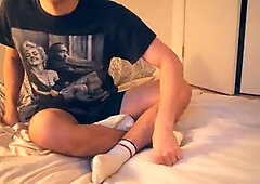 Latino twink jacks off his thick cock in tight dark shorts