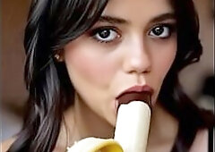 Wednesday addams playing with the banana