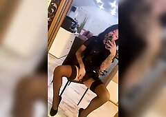 A shapely trans angel in a ebony latex suit