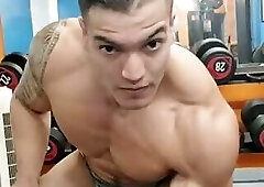 Dickie Armstrong Lifting Weights In Silver Posing Trunks