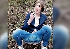 Clothed up in jeans and high top converse sneakers. Playing with my sex tool in the woods