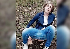 Clothed up in jeans and high top converse sneakers. Playing with my sex tool in the woods