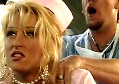 In this steamy amateur video, American blonde bombshell Jill Kelly, donning sexy lingerie, plays a naughty doctor who gives her patient a blowjob and 