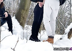 Young woman and man engage in deep rimming and oral sex in a snowy forest