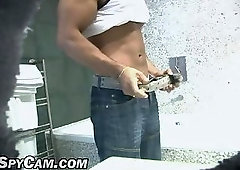 Beefy brunette showering