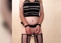 t-girl serf in slavery with throat dilation in taut chastity anally punished with a bottle.