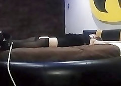 Bound BDSM slave girl waits for her punishment in bed