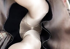 Wearing a lengthy plaid silky lined pencil petticoat with a silky ebony half slide and glossy hose.