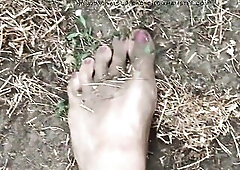 Doing some garden work barefoot , there’s lots of sand and foul closeup