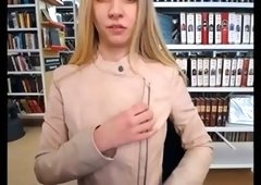 Slim and sexy blonde stripping in public library