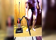 Holding my urinate whilst vacuum cleaning the bedroom undressed with pee dancing , then desperately pissing in trashcan