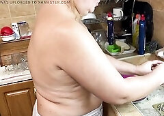 Zara Charm turns everyday household chores into a enjoyment, flirty performance in the kitchen. Stripping down topless with the music channel playing 