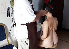 Camera in in nature's garb barbershop. Hairdresser makes disrobe lady ho cut her hair. Barber, nudism. WEBCAM 1