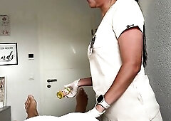 Hawt masseuse puts on taut white latex gloves and begins massaging his legs. This guy gets hard and starts jerking his dong right in front of her. Tha