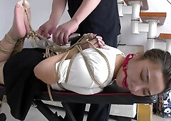 Slender Asian Girl With Sexy Legs Is Introduced To Bondage