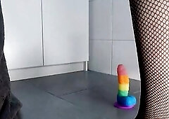 Large booty tranny in fishnet nylons and hot underware riding rainbow sex toy