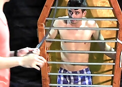 Caged boy is being whipped and seduced through BDSM