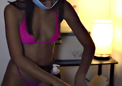 Skinny amateur brunette in mask gives oiled handjob and massage to client