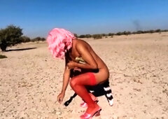 Beautiful strawberry trans doll Misaelechowski unwraps in public while wearing a dress, pantyhose, and heels