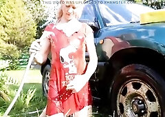 Wetting myself with pantyhose whilst washing a car wearing in red costume