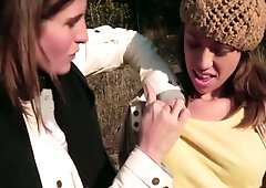 Two women explore each other outdoors with toys and oral passion