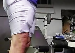 Football  practice uniform and coach relaxing after team leaves