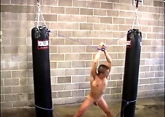 Boxer stripped chained to punching bags and milked by his enemy