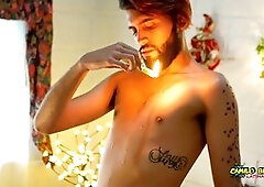 Young uncut Latino Camilo Brown enjoys festive wax play while listening to carols