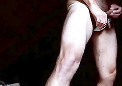 Cute white strap discovered near textille trash